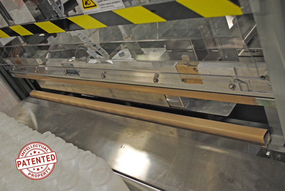 SemiAuto-Bagging-LightningBars-p Patented Lightning Bars for Dyco Inc's Semi-Automatic Bottle Bagging machine for plastic bottles